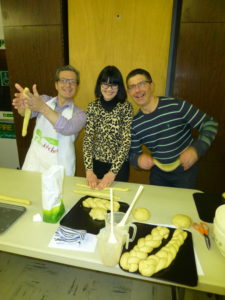 Members enjoying preparing their dough